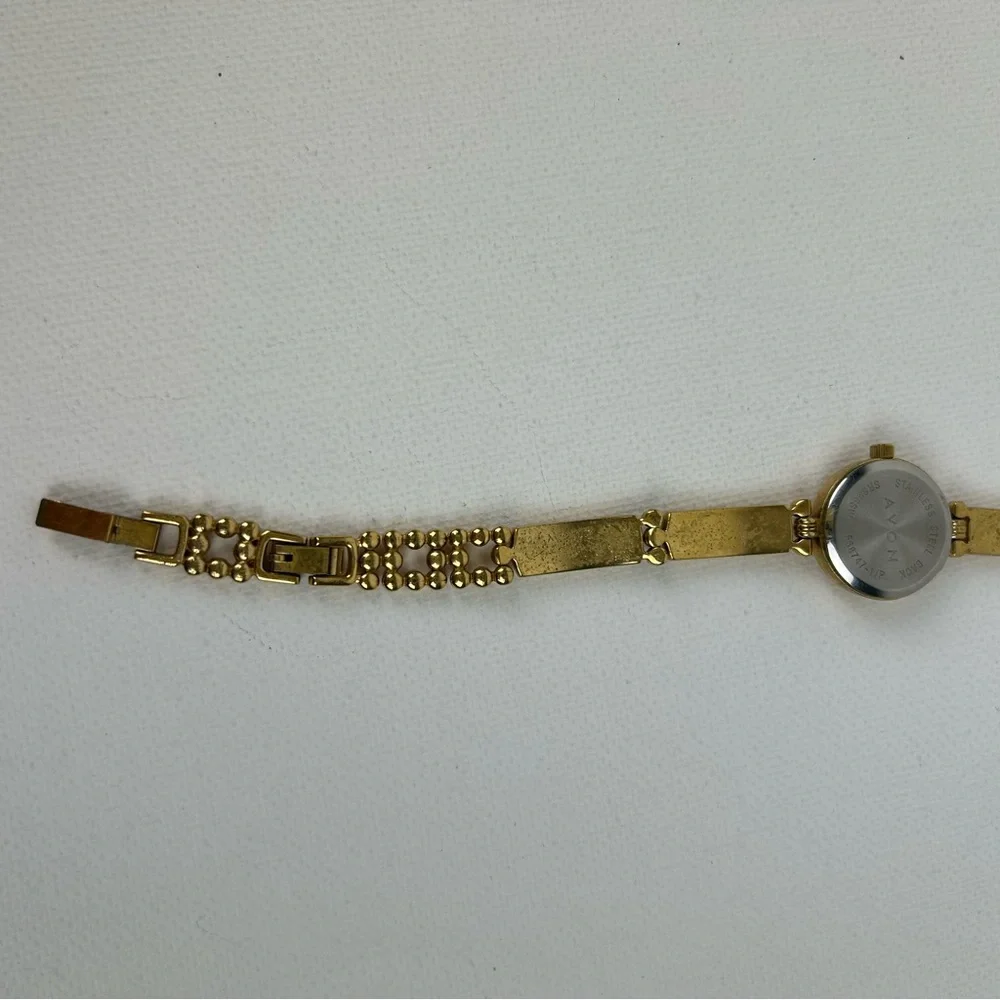 Elegant Avon Gold Tone Watch with Yellow Accents, 1